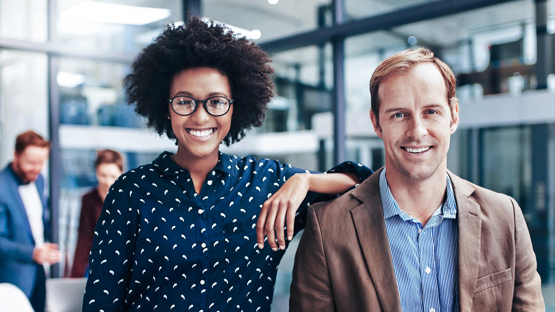 A man and a woman are looking at the camera