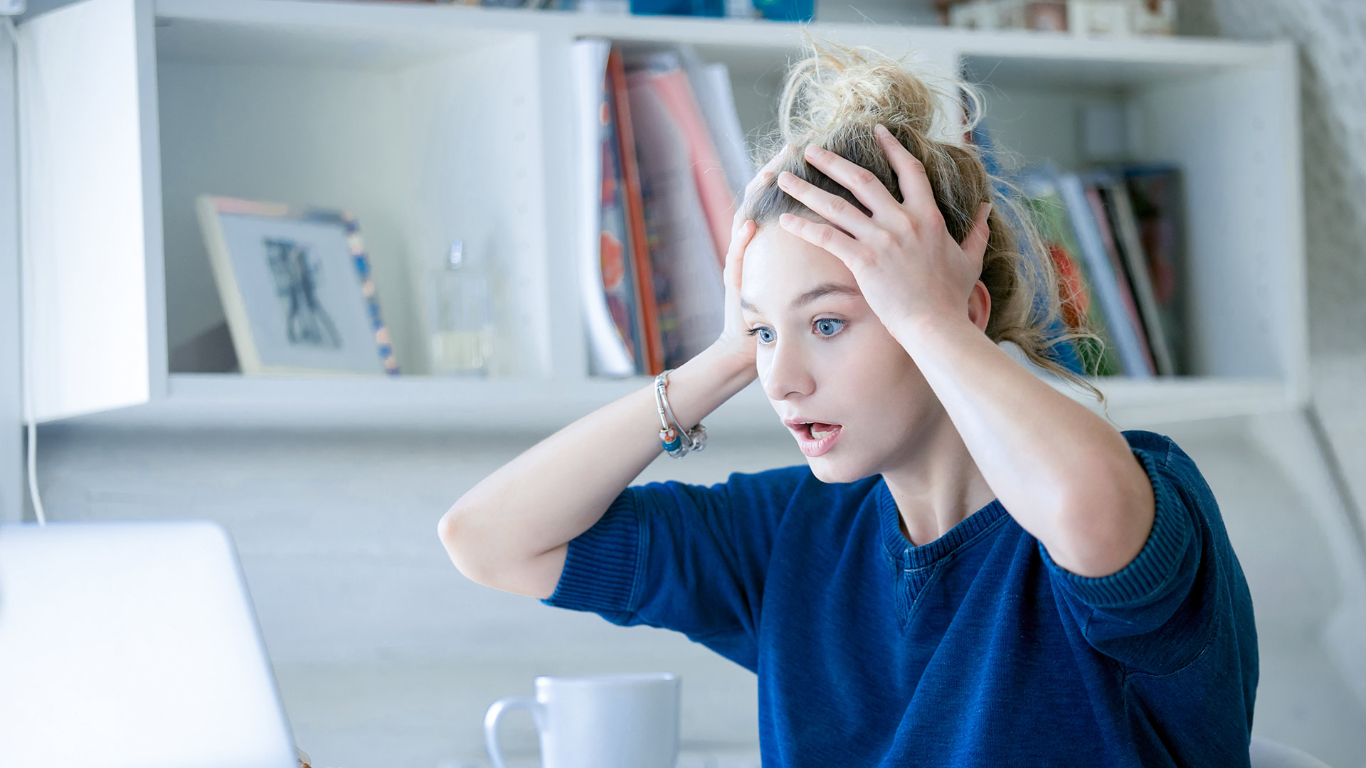 Image: Woman on a desk is scared